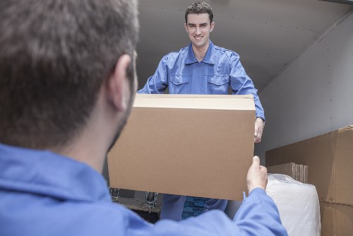 Removal team planning a local move in Earlsfield with boxes and furniture