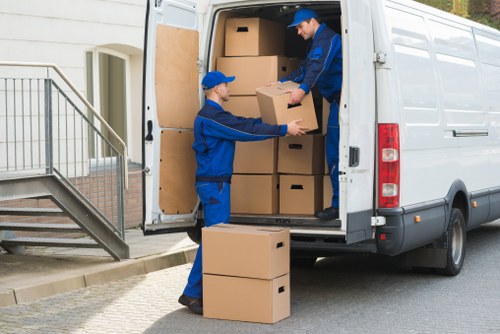 Helper carrying boxes during an Earlsfield move