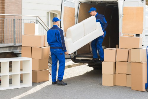 Professional movers handling furniture protection during an Earlsfield removal