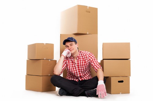 Professional house movers handling furniture and boxes for an Earlsfield relocation